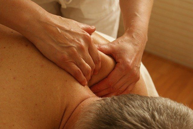 deep tissue massage or sports massage on a man's back